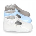 New T-Strap shoes for babies with Velcro strap, button and waves design in patent leather.