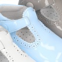 New T-Strap shoes for babies with Velcro strap, button and waves design in patent leather.