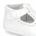 New T-Strap shoes for babies with Velcro strap, button and waves design in patent leather.