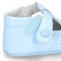 New T-Strap shoes for babies with Velcro strap, button and waves design in patent leather.