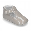 New T-Strap shoes for babies with Velcro strap, button and waves design in patent leather.