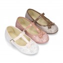 Cotton canvas T-strap Mary Jane shoes with shiny and patent effects.