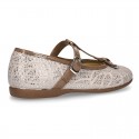 Cotton canvas T-strap Mary Jane shoes with shiny and patent effects.