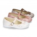 Cotton canvas T-strap Mary Jane shoes with shiny and patent effects.