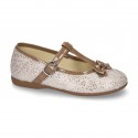 Cotton canvas T-strap Mary Jane shoes with shiny and patent effects.