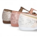 Cotton canvas T-strap Mary Jane shoes with shiny and patent effects.