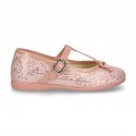 Cotton canvas T-strap Mary Jane shoes with shiny and patent effects.