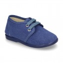 Wash effect cotton canvas laces up shoes for kids.