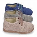 Wash effect cotton canvas laces up shoes for kids.