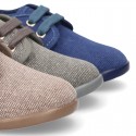 Wash effect cotton canvas laces up shoes for kids.