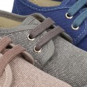 Wash effect cotton canvas laces up shoes for kids.