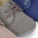 Wash effect cotton canvas laces up shoes for kids.