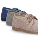 Wash effect cotton canvas laces up shoes for kids.