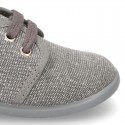 Wash effect cotton canvas laces up shoes for kids.