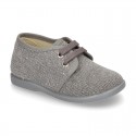 Wash effect cotton canvas laces up shoes for kids.