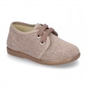 Wash effect cotton canvas laces up shoes for kids.