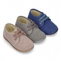 Wash effect cotton canvas laces up shoes for kids.