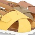 NUBUCK leather sandal shoes for toddler girls with crossed straps and white soles.