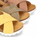 NUBUCK leather sandal shoes for toddler girls with crossed straps and white soles.