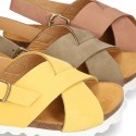 NUBUCK leather sandal shoes for toddler girls with crossed straps and white soles.