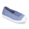 Cotton canvas kids Bamba type shoes with central elastic band and toe cap.