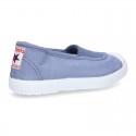 Cotton canvas kids Bamba type shoes with central elastic band and toe cap.