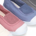 Cotton canvas kids Bamba type shoes with central elastic band and toe cap.