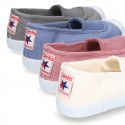 Cotton canvas kids Bamba type shoes with central elastic band and toe cap.