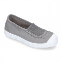 Cotton canvas kids Bamba type shoes with central elastic band and toe cap.