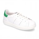 New trendy casual tennis shoes with green counter.