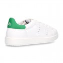 New trendy casual tennis shoes with green counter.