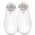 New trendy casual tennis shoes with green counter.