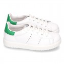 New trendy casual tennis shoes with green counter.