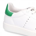 New trendy casual tennis shoes with green counter.