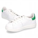 New trendy casual tennis shoes with green counter.