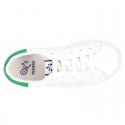 New trendy casual tennis shoes with green counter.