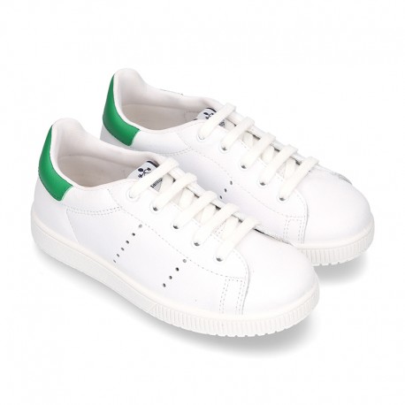 New trendy casual tennis shoes with green counter.