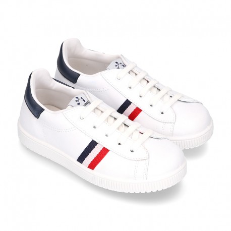 Casual washable leather kids tennis shoes with flag design.