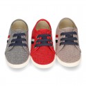 New WASHED EFFECT canvas tennis style shoes with flag detail.