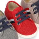 New WASHED EFFECT canvas tennis style shoes with flag detail.