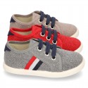 New WASHED EFFECT canvas tennis style shoes with flag detail.