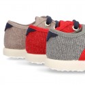 New WASHED EFFECT canvas tennis style shoes with flag detail.