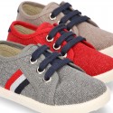 New WASHED EFFECT canvas tennis style shoes with flag detail.