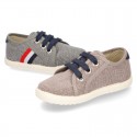 New WASHED EFFECT canvas tennis style shoes with flag detail.