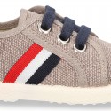 New WASHED EFFECT canvas tennis style shoes with flag detail.