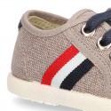 New WASHED EFFECT canvas tennis style shoes with flag detail.