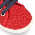 New WASHED EFFECT canvas tennis style shoes with flag detail.