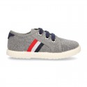 New WASHED EFFECT canvas tennis style shoes with flag detail.