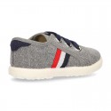 New WASHED EFFECT canvas tennis style shoes with flag detail.