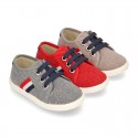 New WASHED EFFECT canvas tennis style shoes with flag detail.
